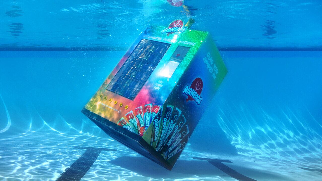 Airheads made an underwater vending machine to get adults back in the pool this summer